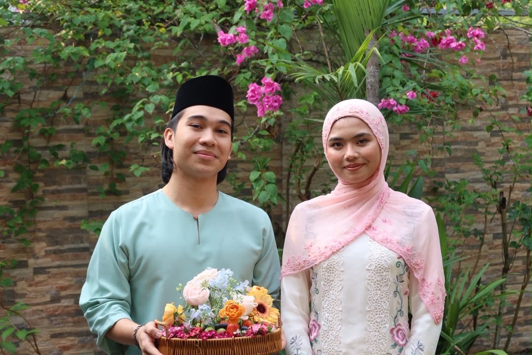Mia and Arief with a flower basket, in sage and pink